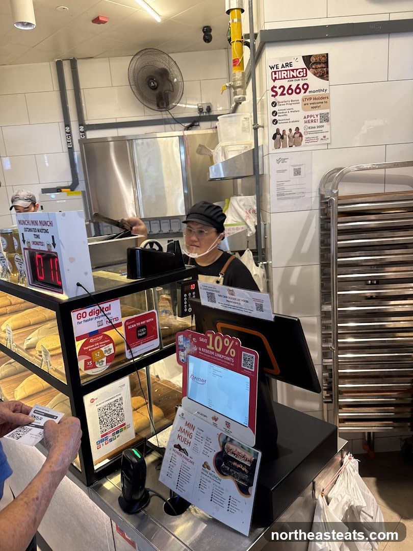 Counter with food display and hiring advertisement