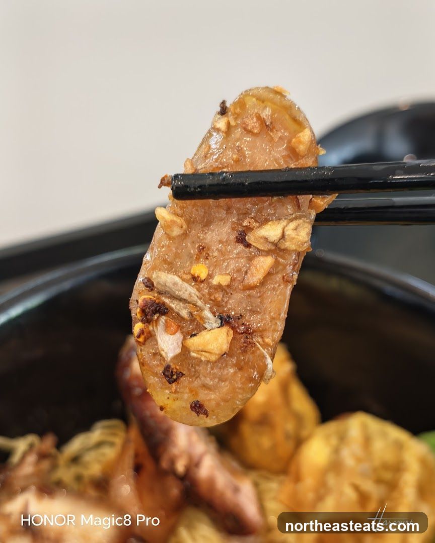 Close-up of a piece of food with garlic and chili flakes