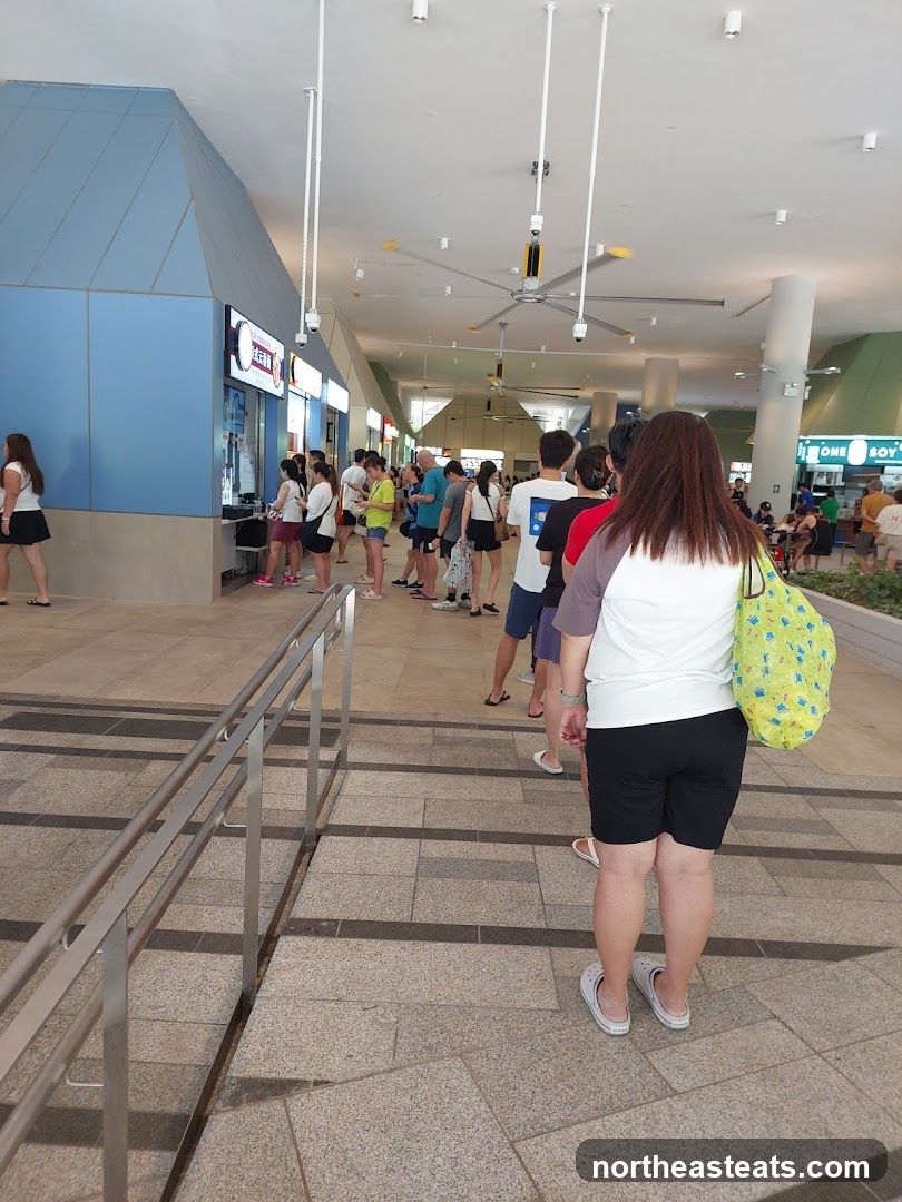 People queuing at a food court