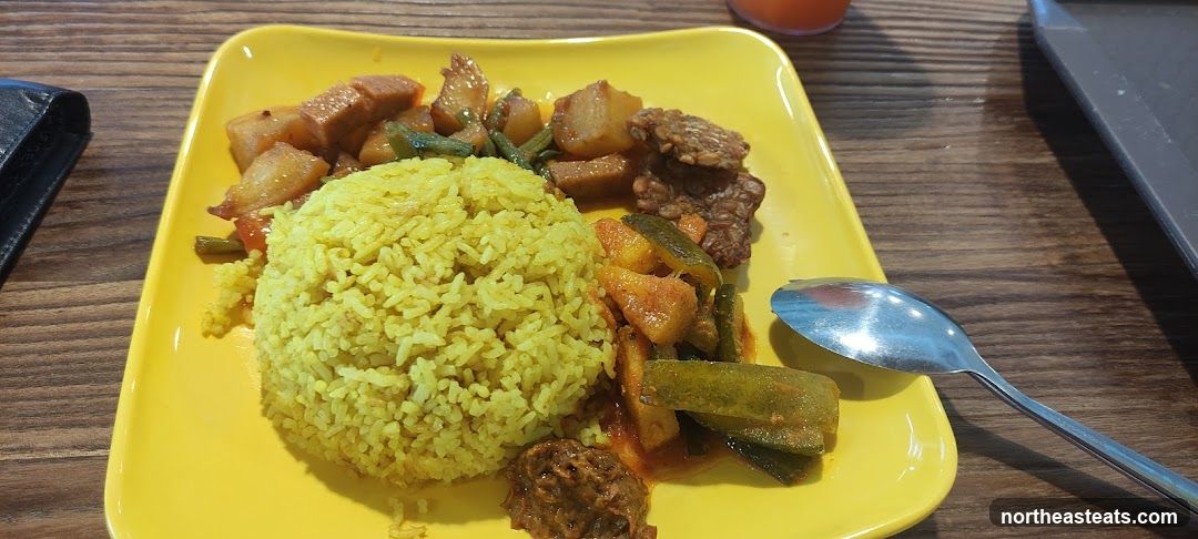 Plate of food with rice and vegetables