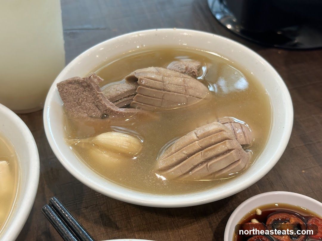 Bowl of Soup with Meat and Garlic