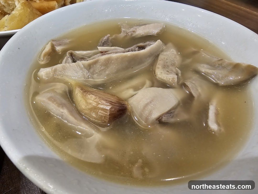 Bowl of Soup with Meat and Garlic