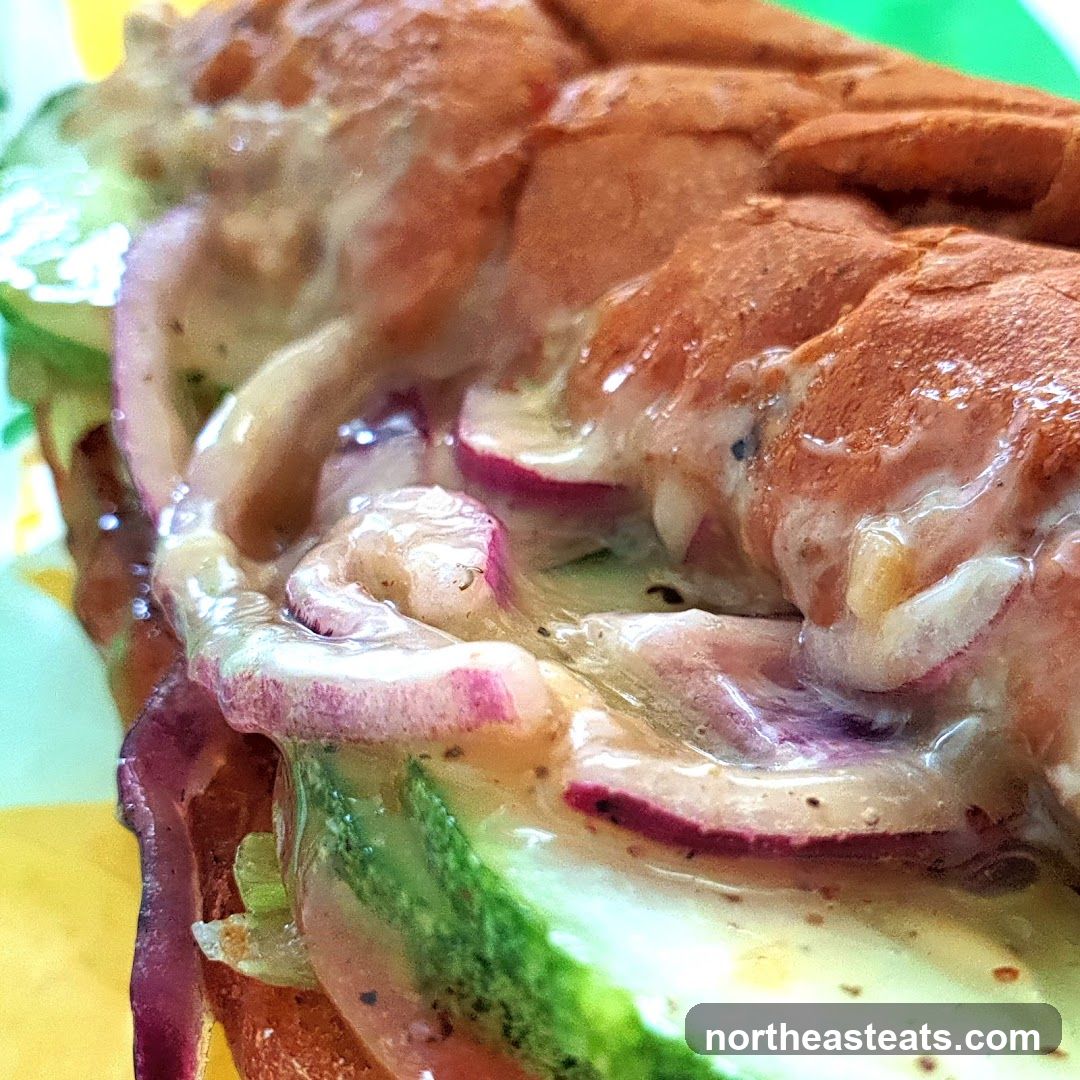 Close-up of a sandwich with sauce and vegetables