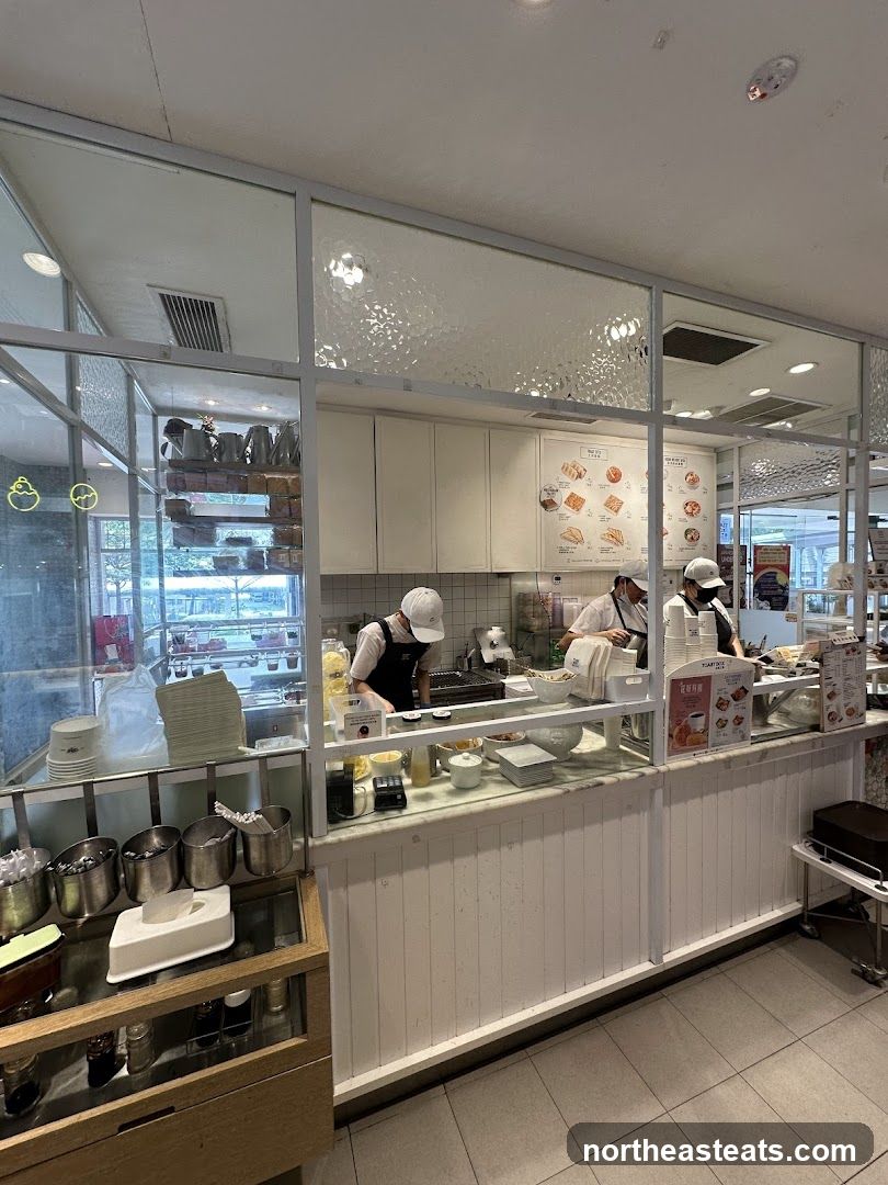 Cafe interior with staff preparing food