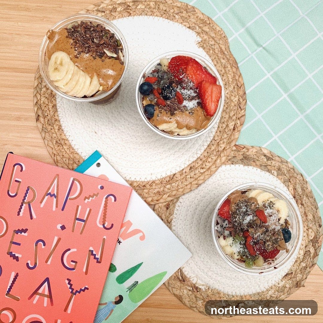 Three smoothie bowls with fruit and nuts