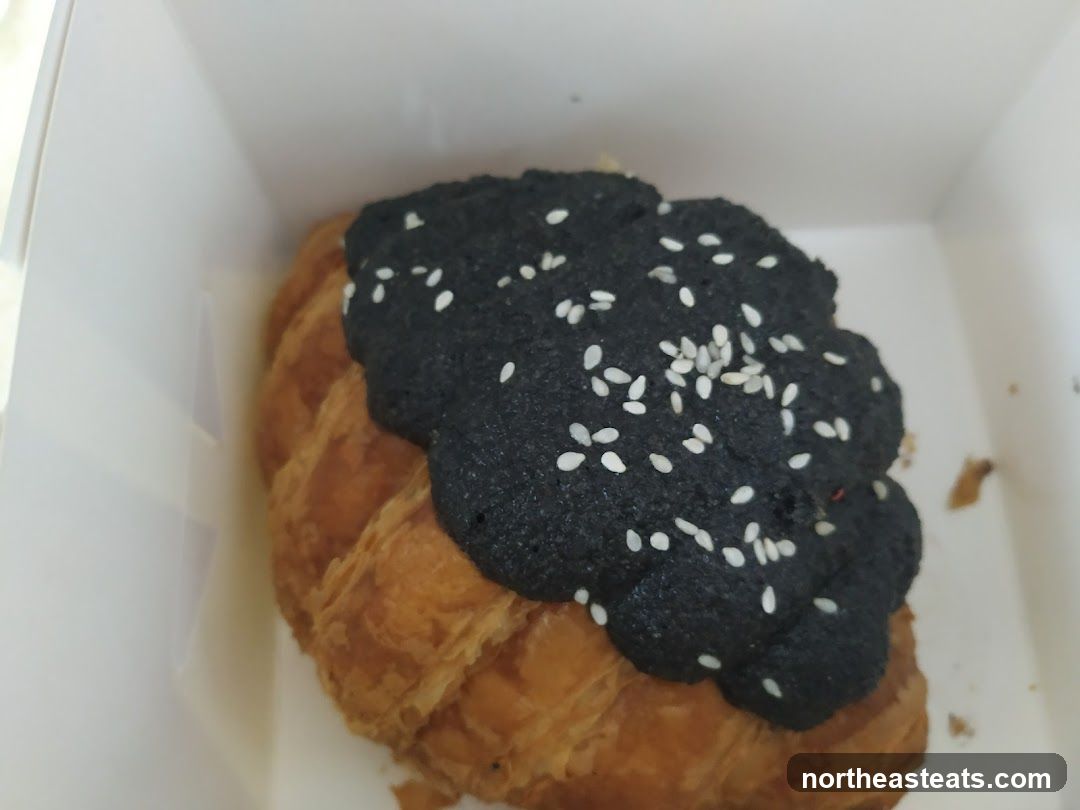 Croissant with Black Topping and Sesame Seeds