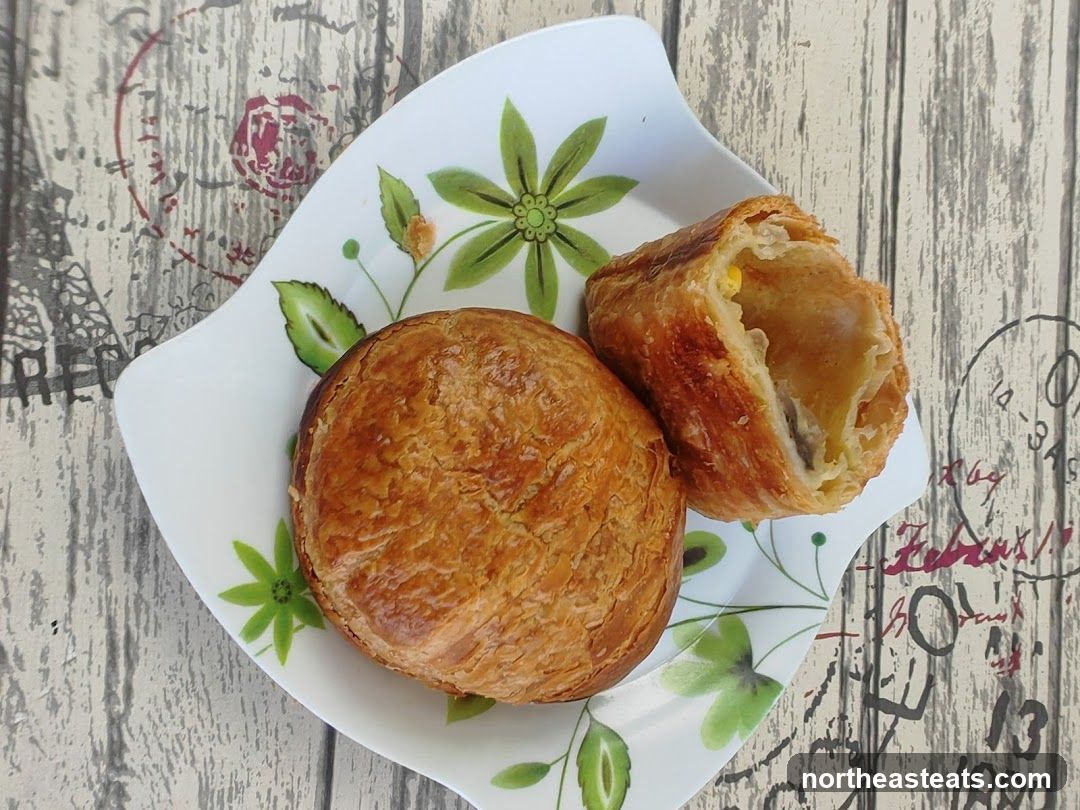 Two pastries on a decorative plate