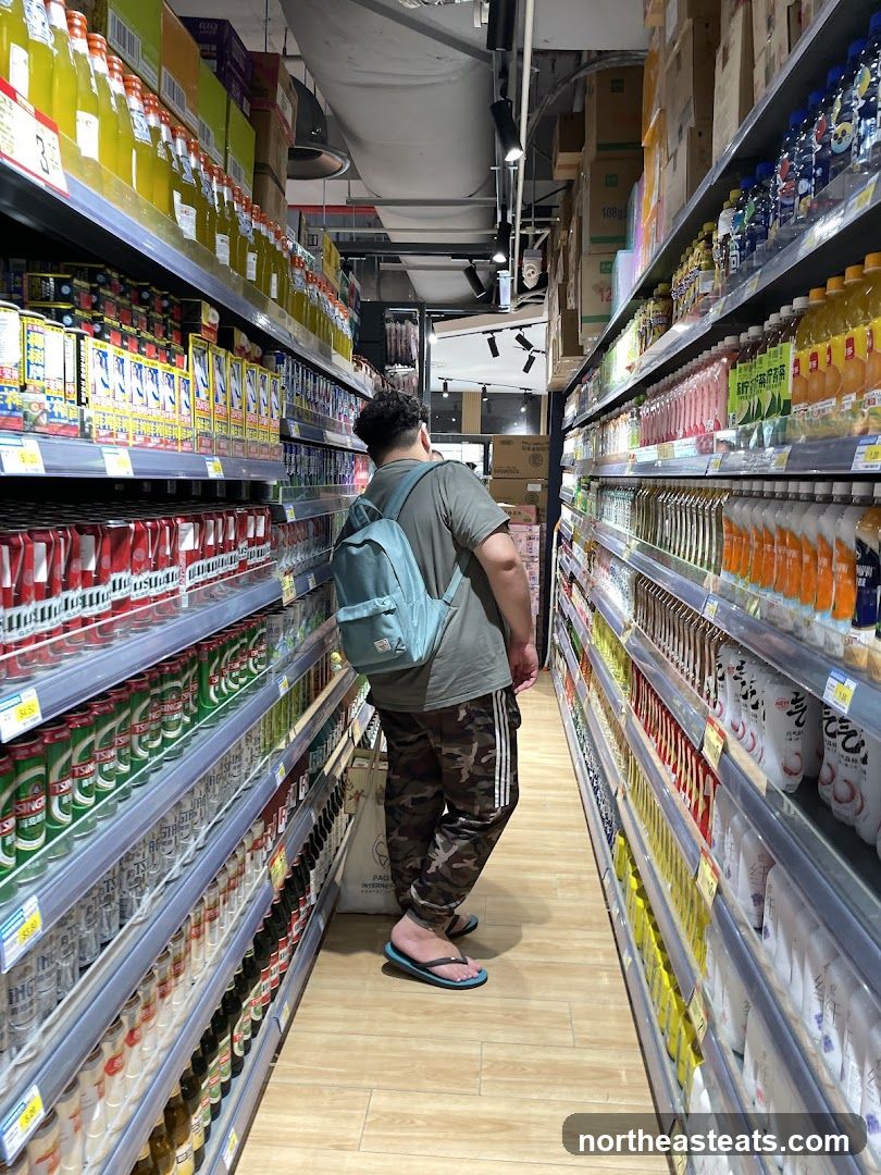 A person walks down a grocery aisle