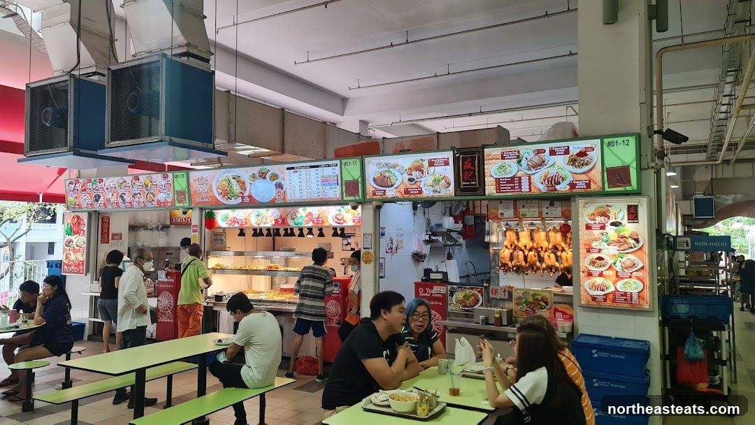 Food court with various stalls and diners