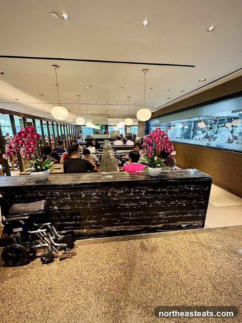 Restaurant Interior with Diners and Open Kitchen