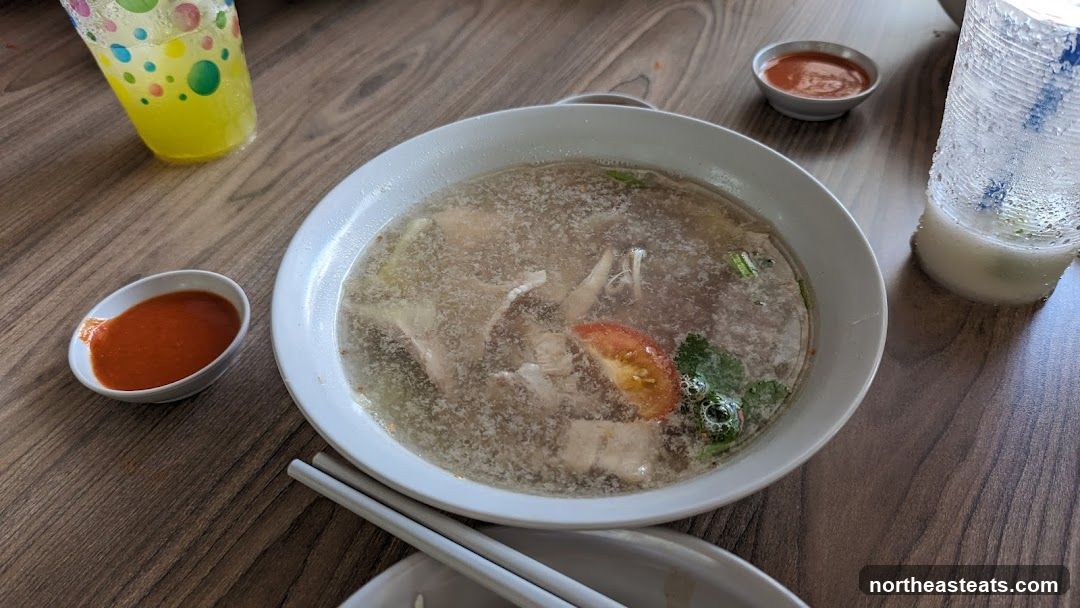 Bowl of soup with side dishes