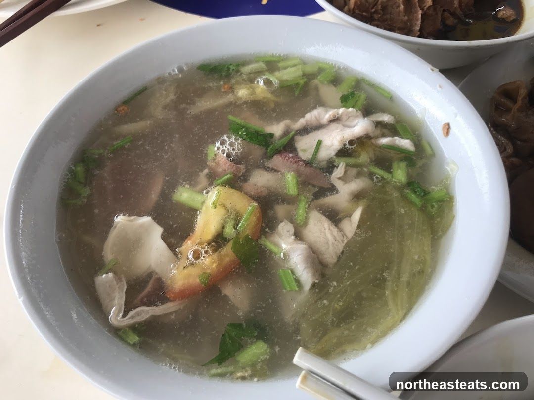 Bowl of Soup with Meat and Vegetables