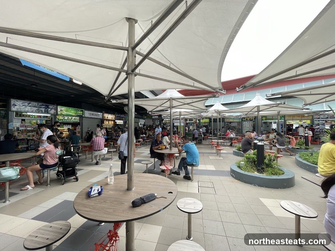 Outdoor Food Court with Many Stalls and Diners
