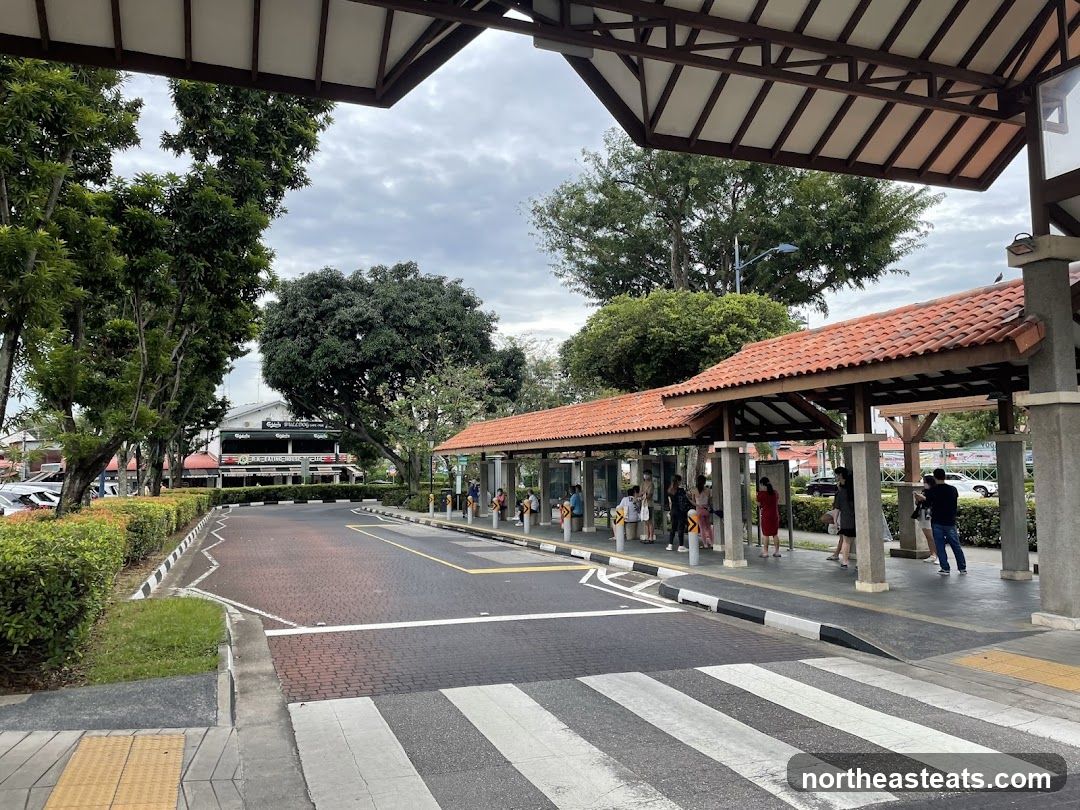 Bus Stop with Building in Background