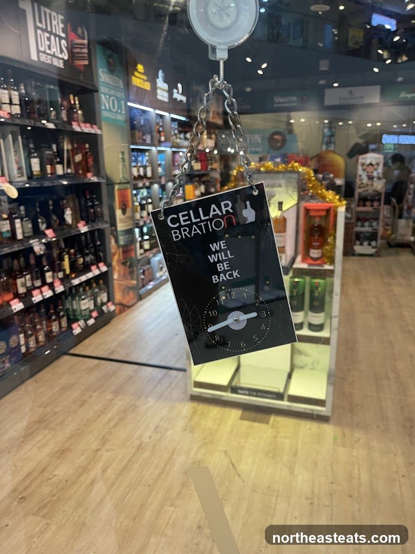 Liquor store with a "We Will Be Back" sign