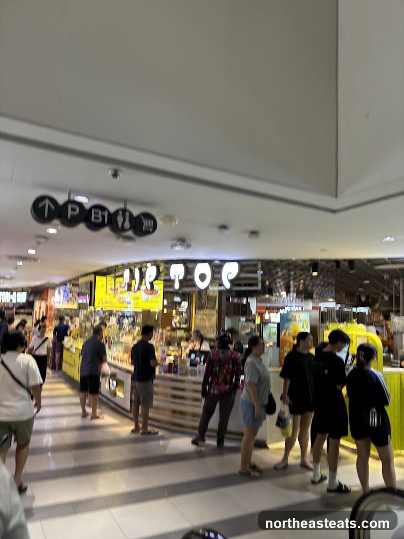 People queuing at a food stall