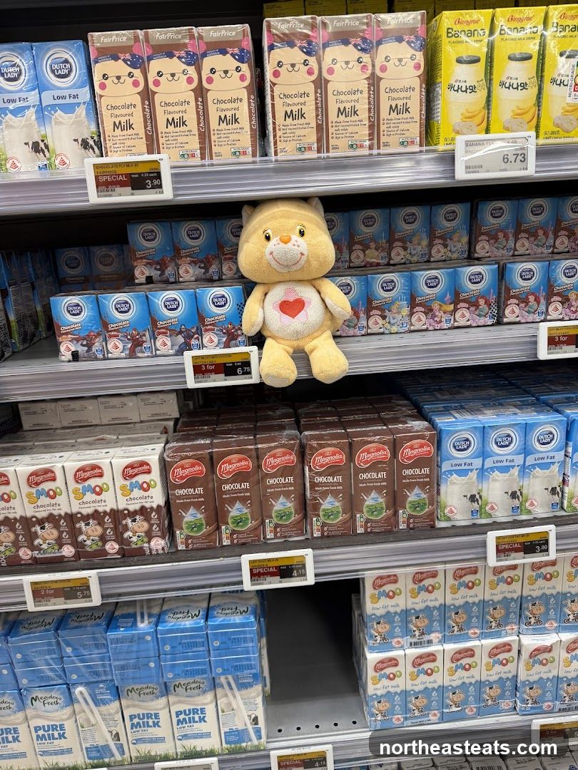 Milk and Chocolate Milk Cartons on Shelves