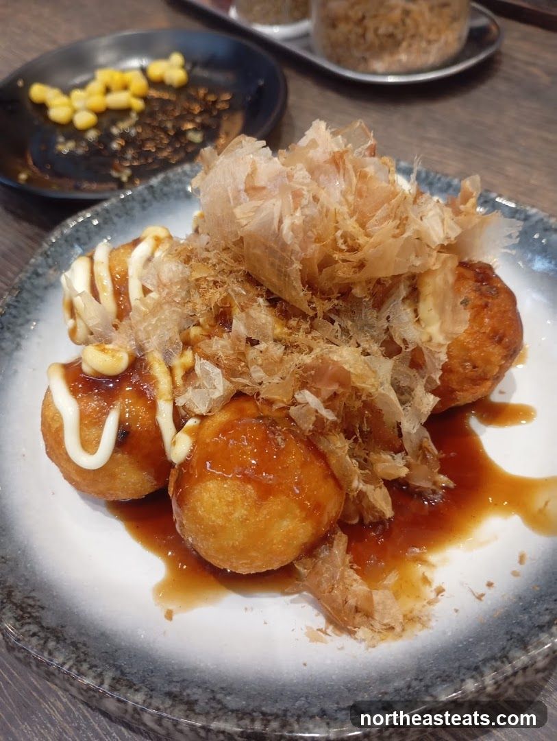 Takoyaki with sauce and bonito flakes
