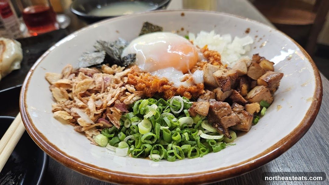 Bowl of food with egg and toppings
