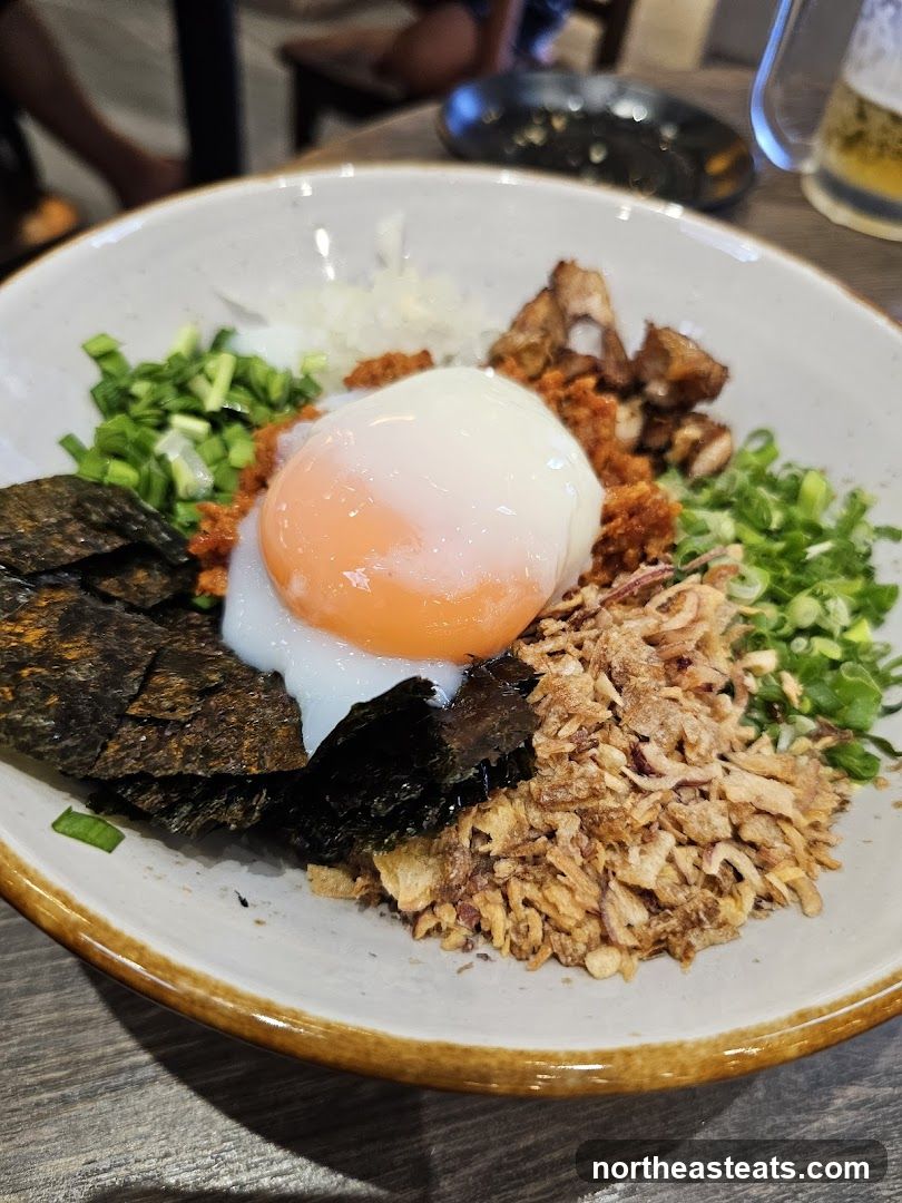 Bowl of food with egg and seaweed