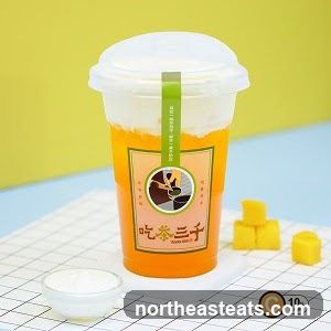 Mango drink with cream topping