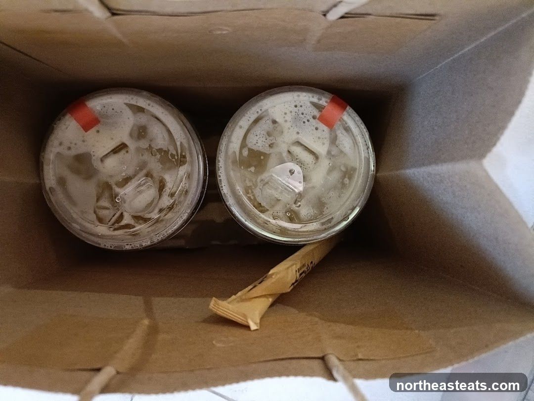 Two drinks in a paper bag