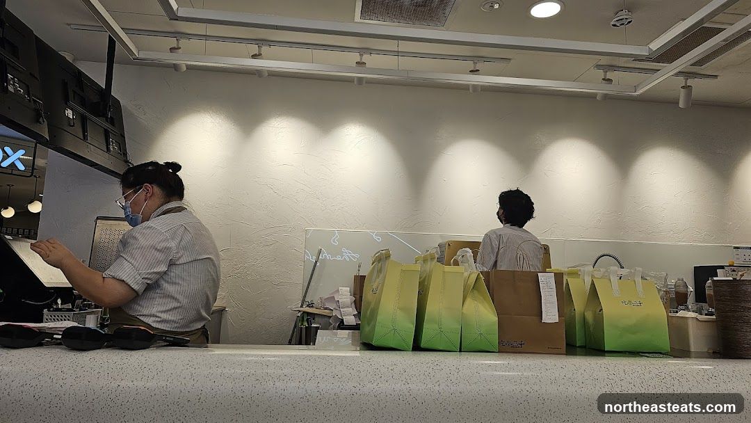 Counter with Staff and Takeaway Bags