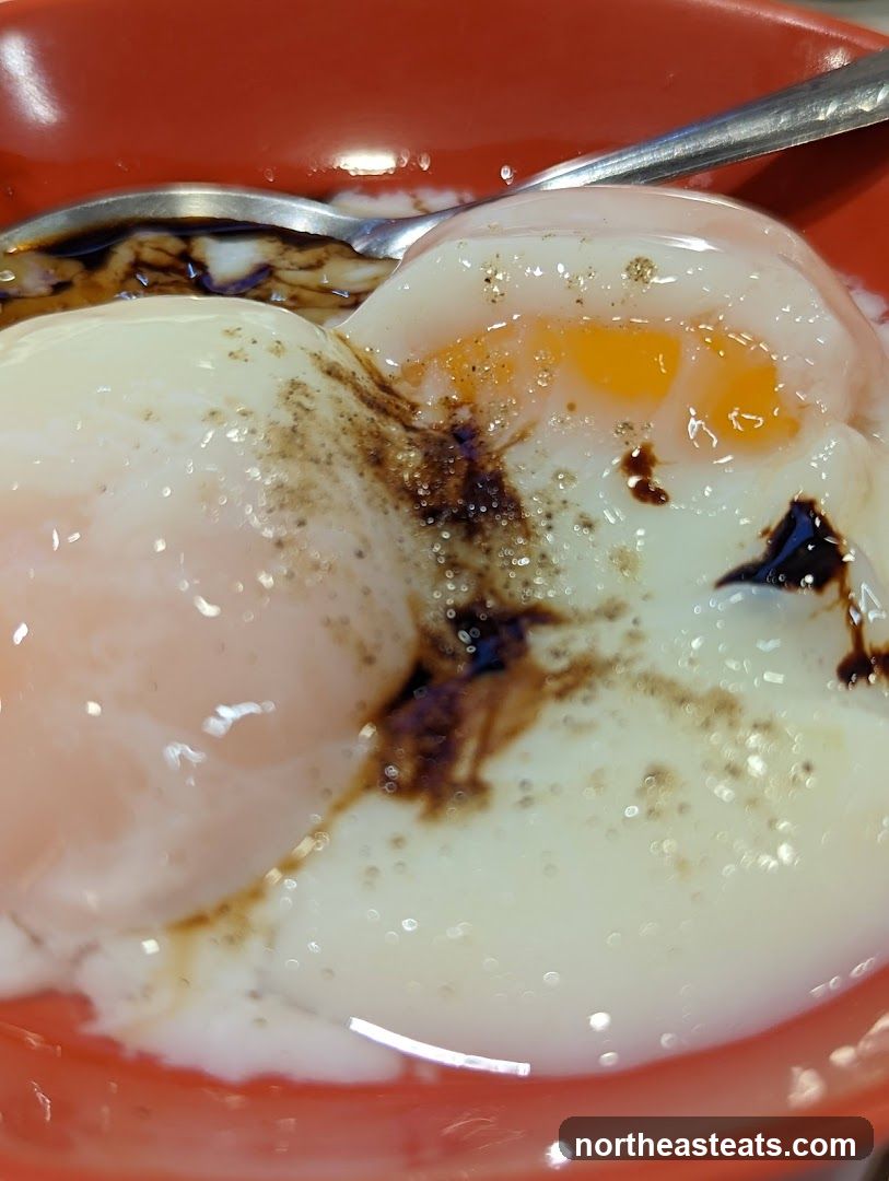 Soft-boiled eggs with soy sauce and pepper