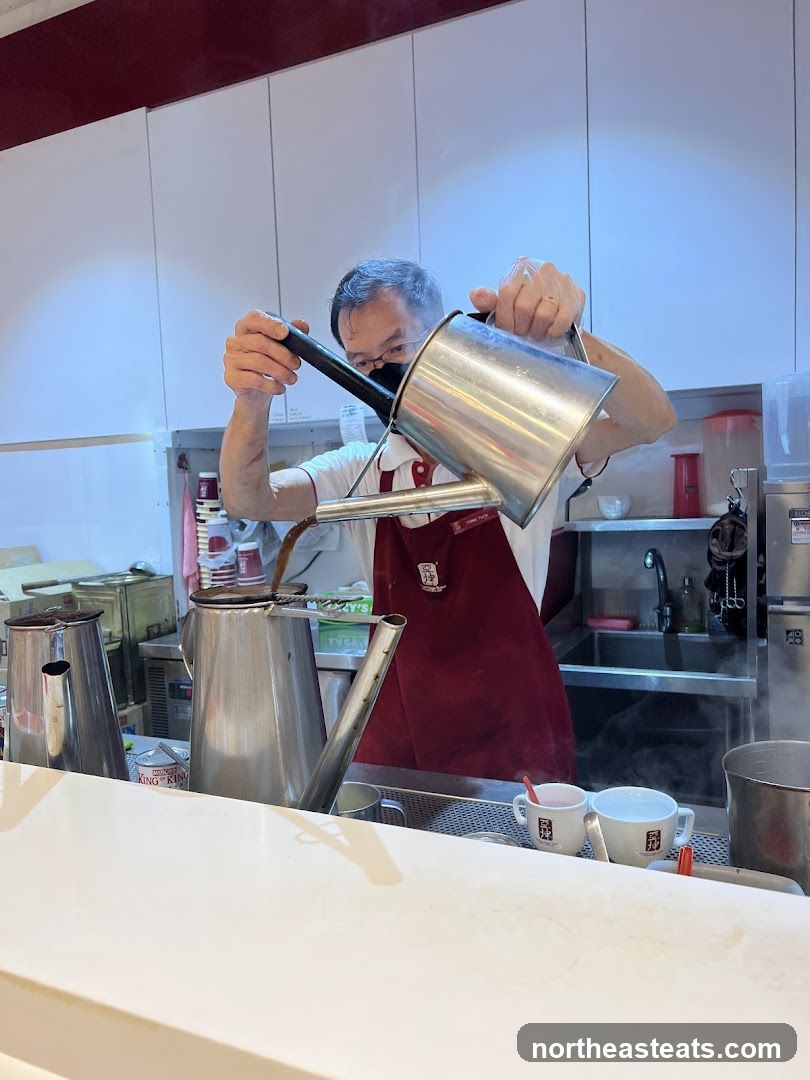 Barista pouring coffee