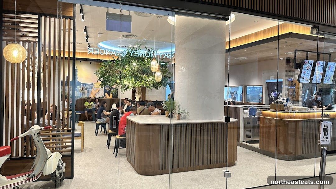 Interior of a modern cafe with seating and a counter