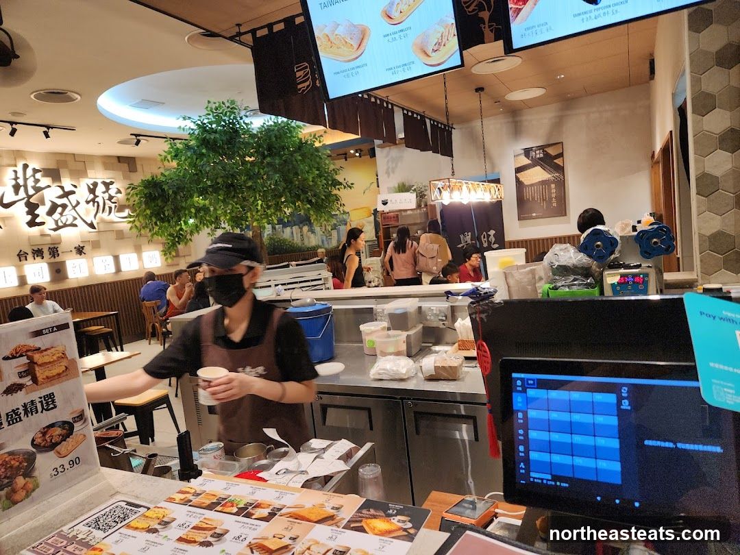 Restaurant Interior with Staff and Menu Displays