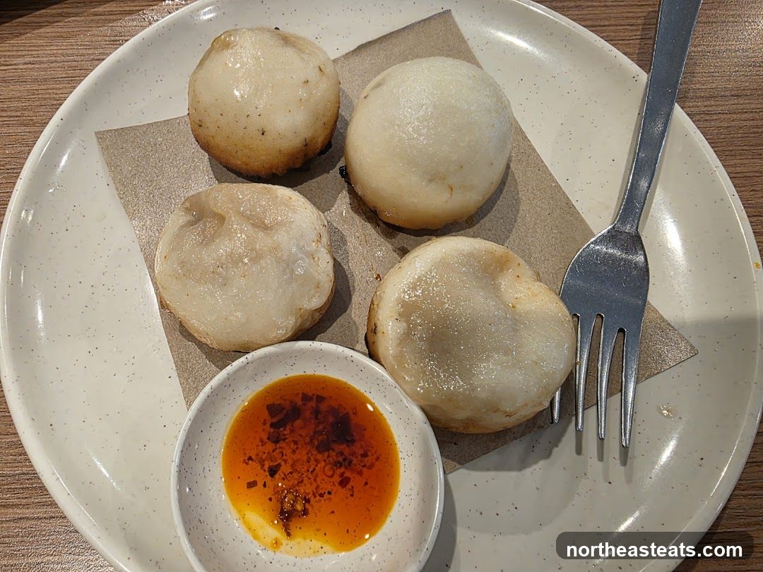 Pan-fried dumplings with dipping sauce
