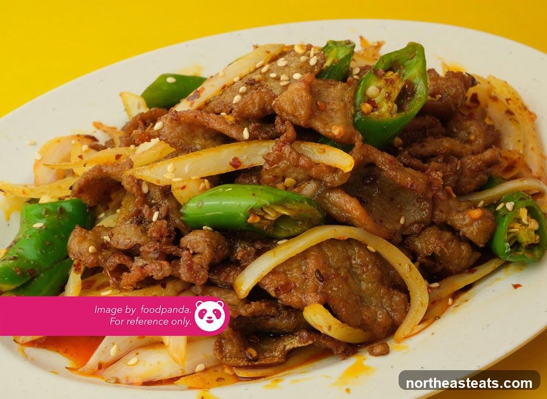 Spicy Stir-Fried Beef with Peppers and Onions