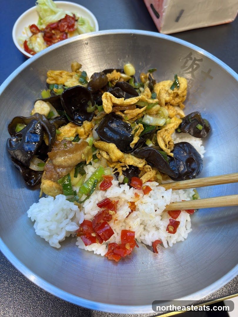 Rice bowl with stir-fried ingredients
