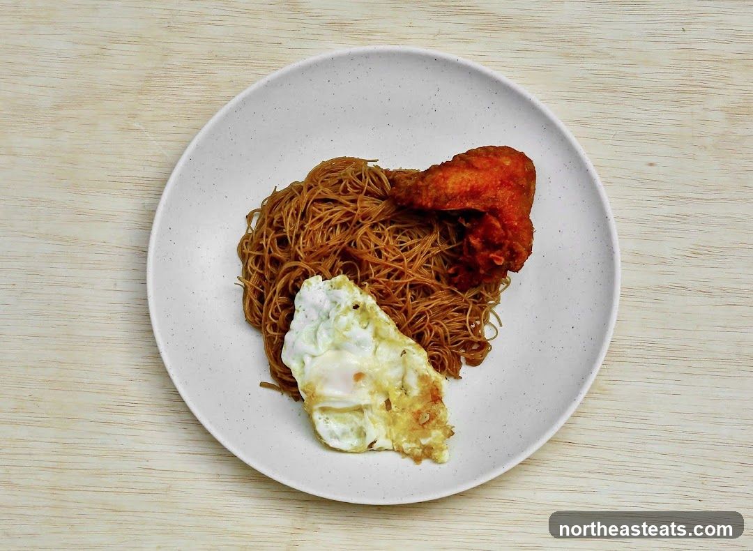 Fried Noodles with Fried Egg and Chicken Wing