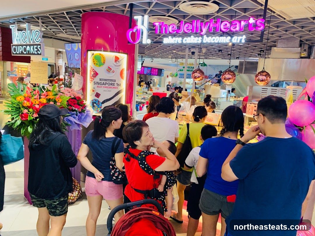 People queuing at a cake shop