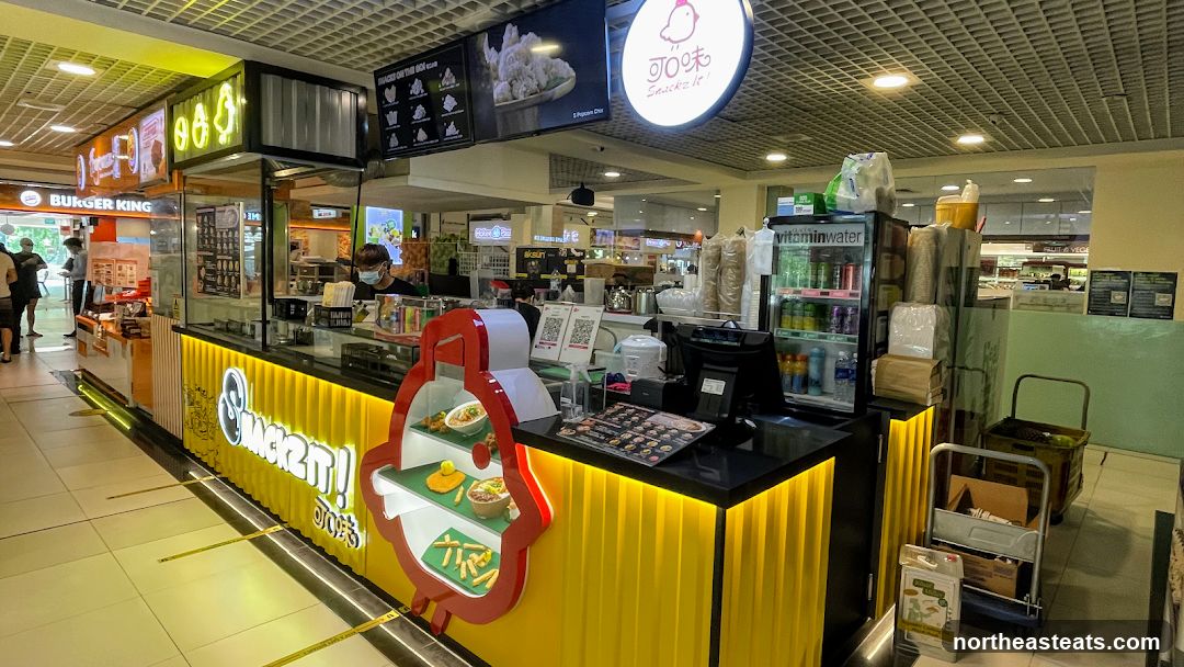 Snack stall with bright yellow facade