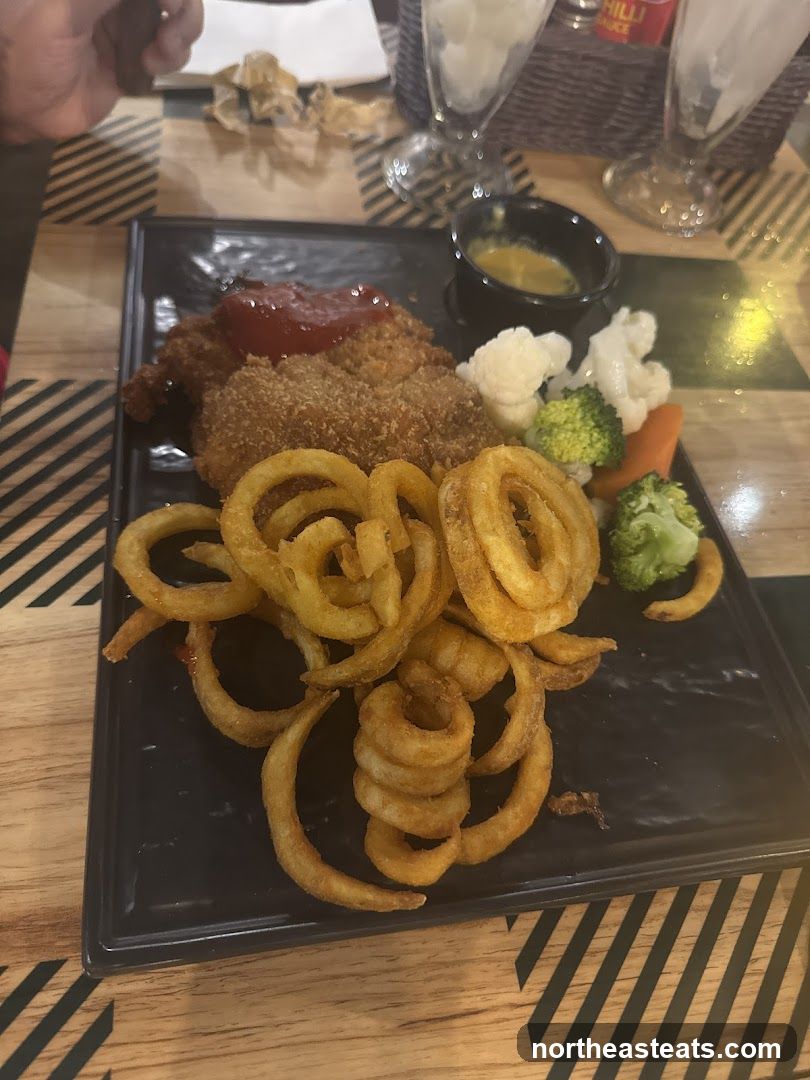Breaded Chicken with Curly Fries and Vegetables