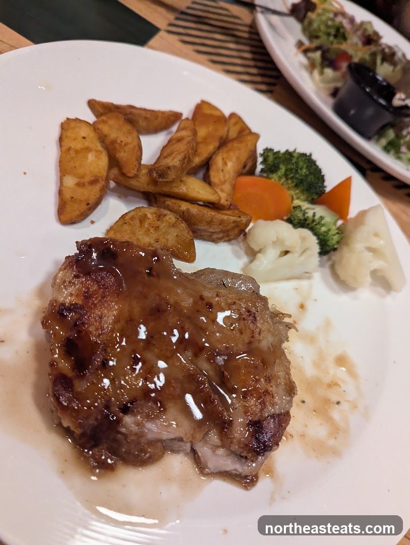 Pork Chop with Potato Wedges and Vegetables