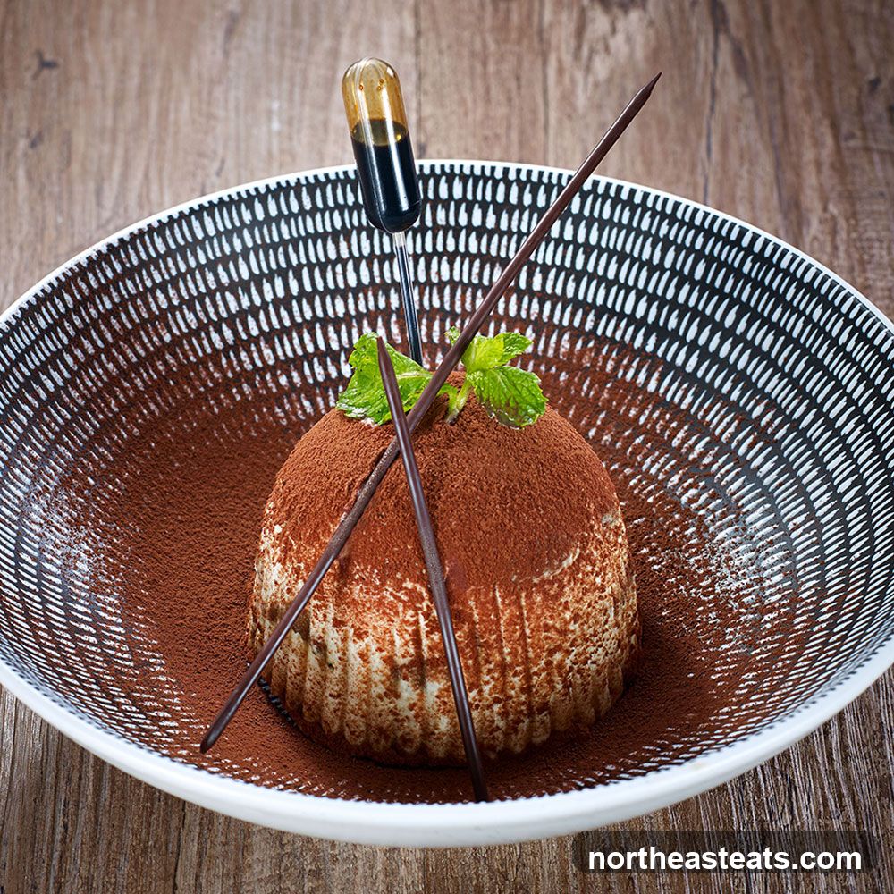 Dessert with Cocoa Powder and Chocolate Sticks