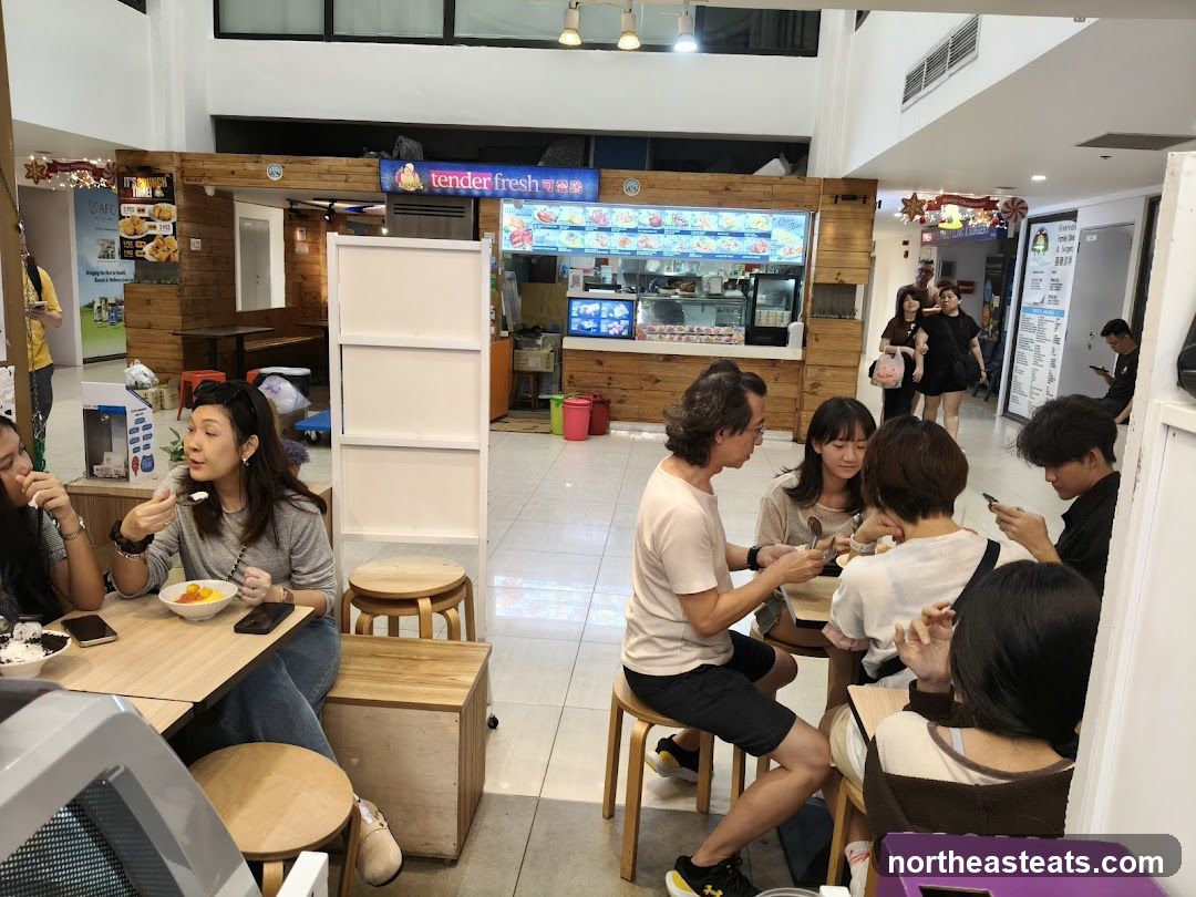 People eating at a food stall