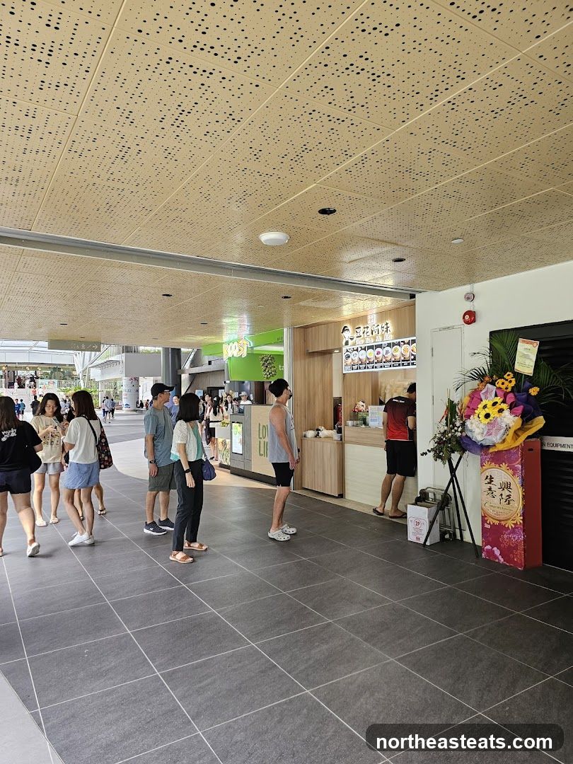 People queuing at a food stall