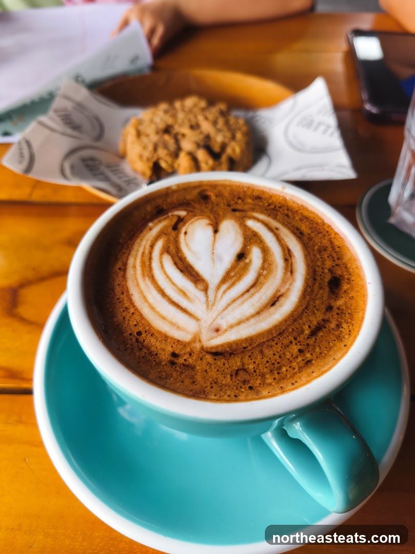 Latte Art Coffee and Cookie