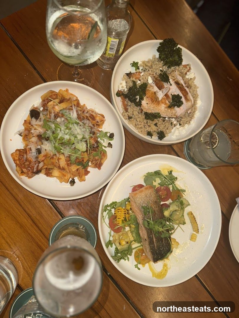 Three Plates of Food and Drinks on a Wooden Table