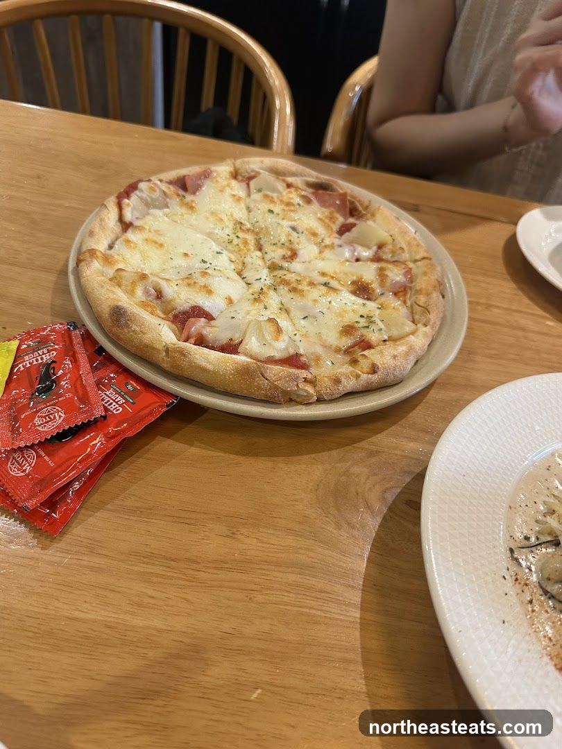 Pizza and Condiments on Table