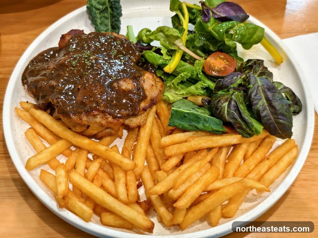 Chicken steak with fries and salad