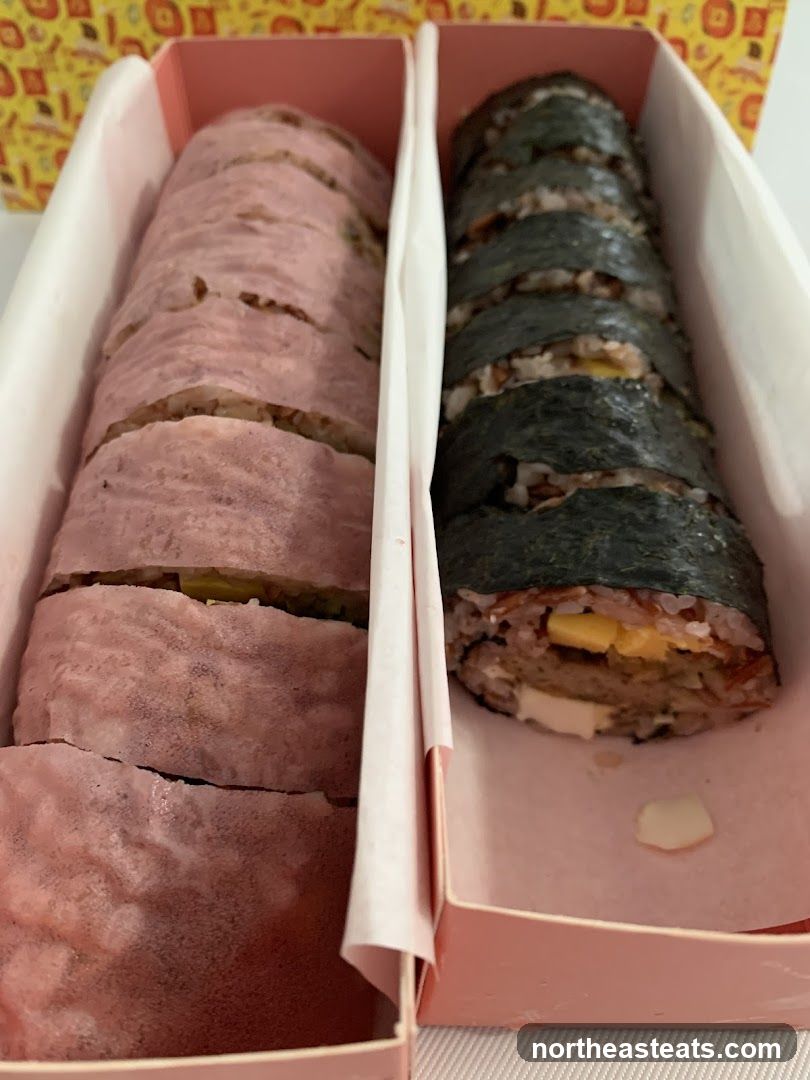 Two types of sushi rolls in a box
