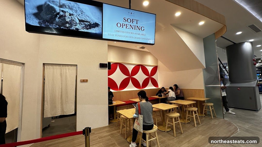Cafe interior with soft opening announcement