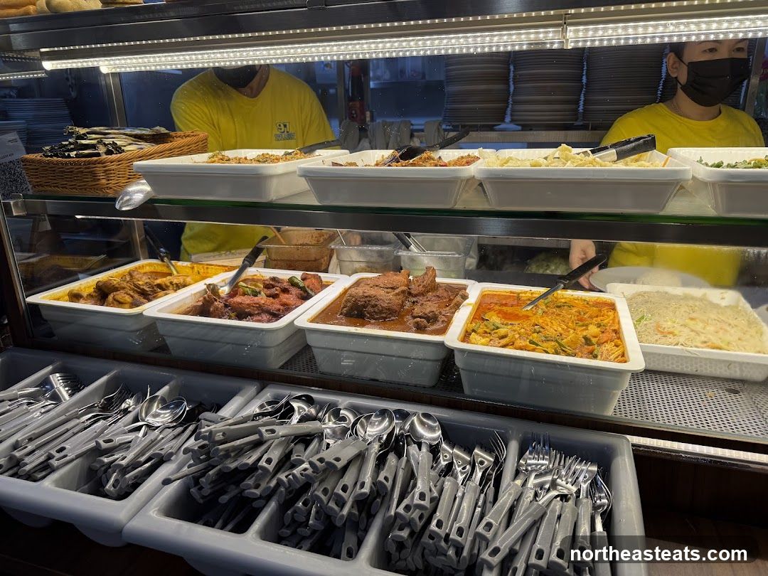 Buffet Display with Various Dishes and Cutlery