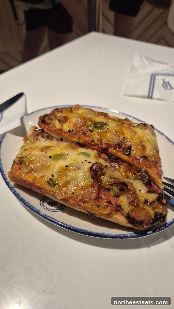 Two slices of pizza on a plate